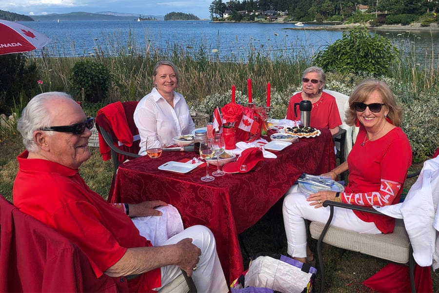 Guests at a miniature Dinner en Rouge brought their own food, dishes and cutlery in order to help maintain physical distancing. Tables were placed eight feet apart so groups would not intermingle. (Courtesy of Nigel Scott)