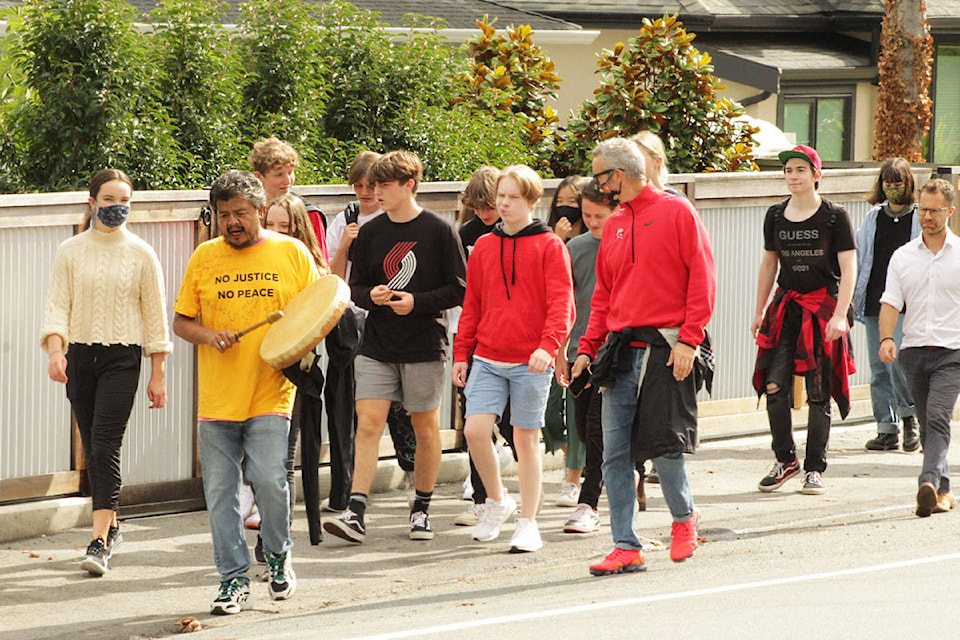 Students from Claremont Secondary School joined James Taylor on the trek down to Cadboro Bay as he concluded the five-day journey from Hope to Saanich. (Devon Bidal/News Staff)