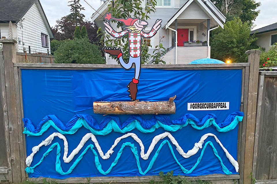 Reb Stevenson, general director of the Gorge Tillicum Community Association, started off their neighbourhood’s amateur art installation event with an Ode to Canadian short film, the Log Driver’s Waltz. (Courtesy of Gorge Tillicum Community Association)
