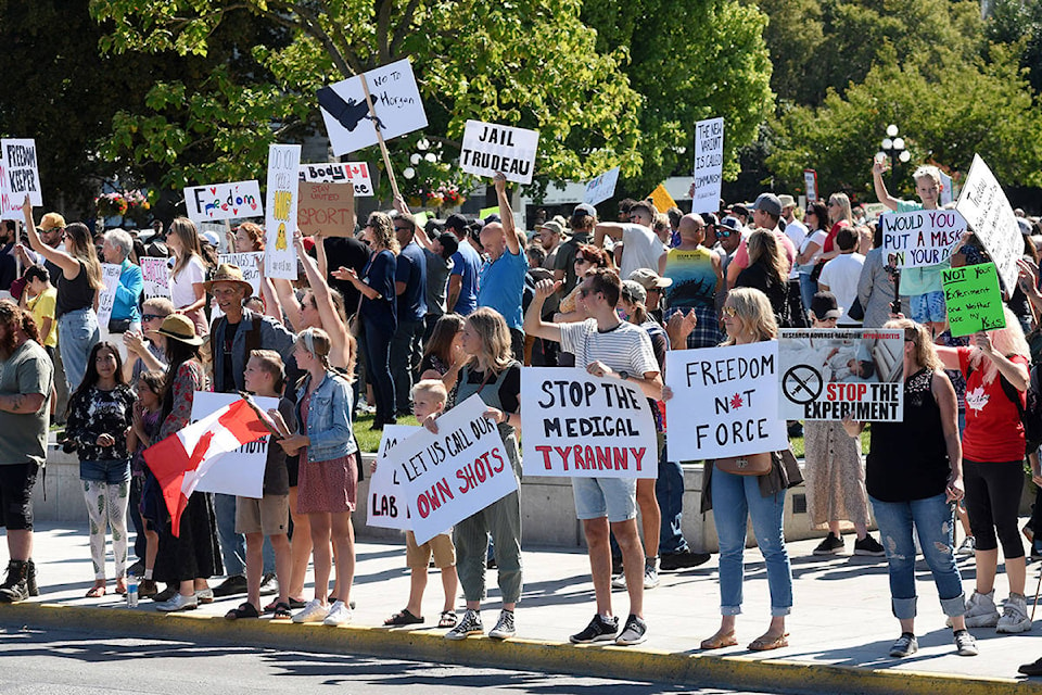 Anti-vaccine passport and anti-mask protesters gather outside the Legislature on Wednesday and along Belleville Street for an afternoon demonstration. (Don Denton/News Staff)