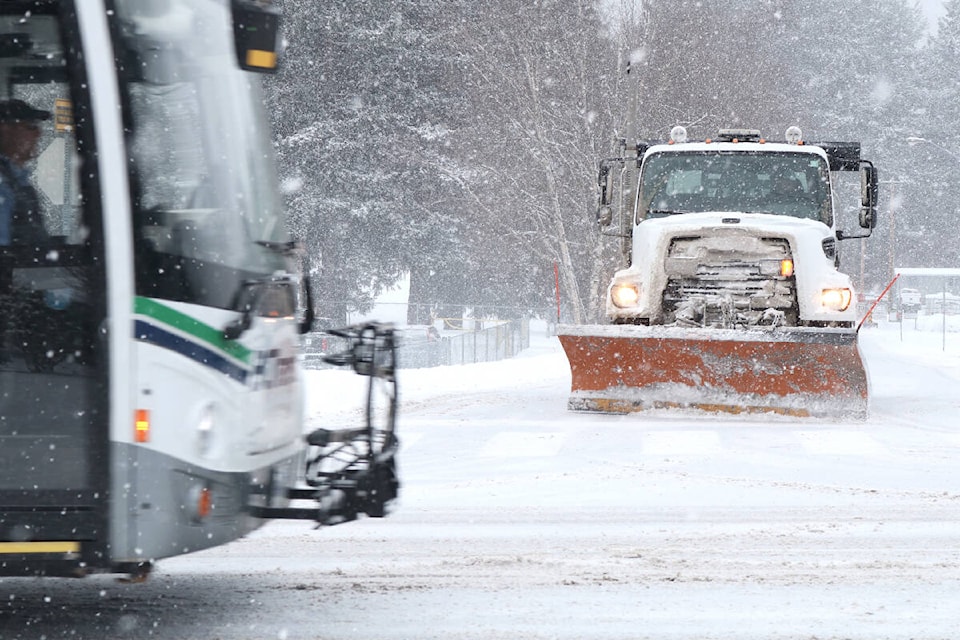 Snowploughs were among the few vehicles on the road during the heavy snow fall on December 26, 2021. (Bailey Moreton/News Staff)