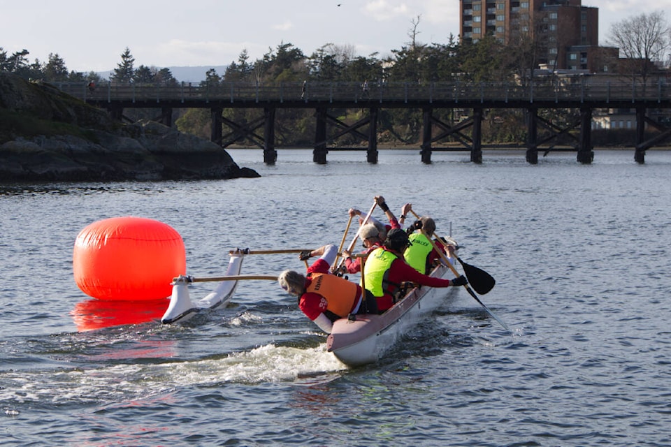 Outrigger racers make a turn during the Kan-U-Hakit sprint event March 6 in front of the Fairway Gorge Paddling Club.(Bailey Moreton/News Staff)