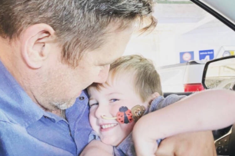 Rob Kemp and his son Bash have enjoy some giggles while travelling to Vancuover for scans recently. (Family photo/GoFundMe)