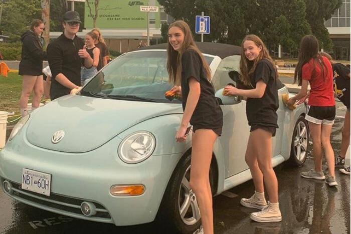 Students kick-off Cops for Cancer fundraising with a car was at Oak Bay High. The event is among many students host to raise cash for Tour de Rock. (Courtesy C4C at Oak Bay High)