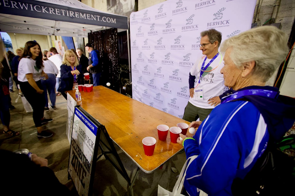 People enjoy a game of beer pong Friday (Sept. 16) during the Rock the Roundhouse party celebrating the successful Greater Victoria 2022 55+ BC Games and officially passing the flag on to the 2023 host city, Abbotsford. (Justin Samanski-Langille/News Staff)