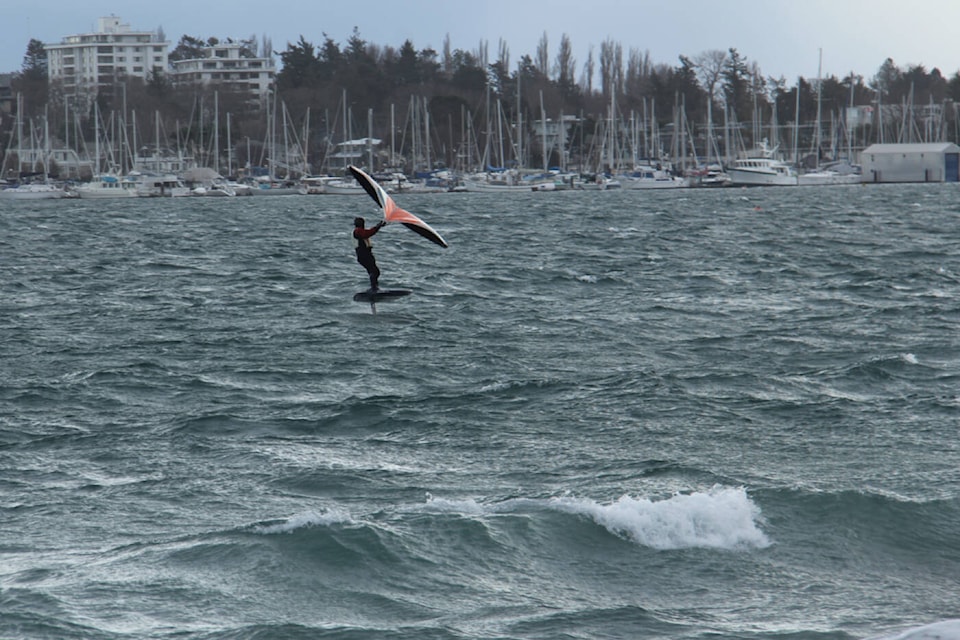 A wing foiler takes to the windy waves off Willows Beach on Jan. 9. (Christine van Reeuwyk/News Staff)