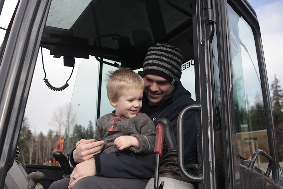 Phil Hillier is joined by dad Chris in the digger at a Campbell River construction site for Phil’s third birthday. Photo by Marc Kitteringham/Campbell River Mirror