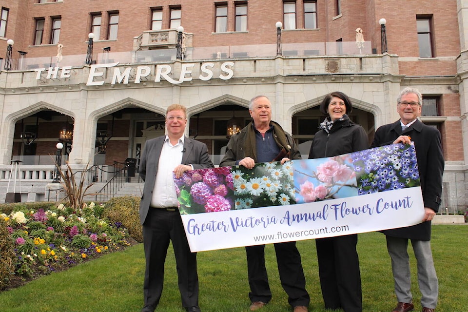 Destination Greater Victoria’s Paul Nursey, left, on the lawn of the Fairmont Empress with Colwood Coun. Dave Grove, Fairmont Empress’ Victoria Dyson and Greater Victoria Chamber of Commerce CEO Bruce Williams. The officials were launching the 2023 Greater Victoria Flower Count, which begins on March 8. (Jake Romphf/News Staff)