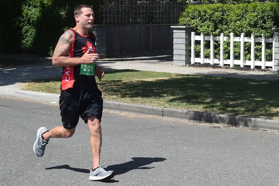 A participant runs during the 17th annual Oak Bay half marathon. (Brendan Mayer/News Staff)