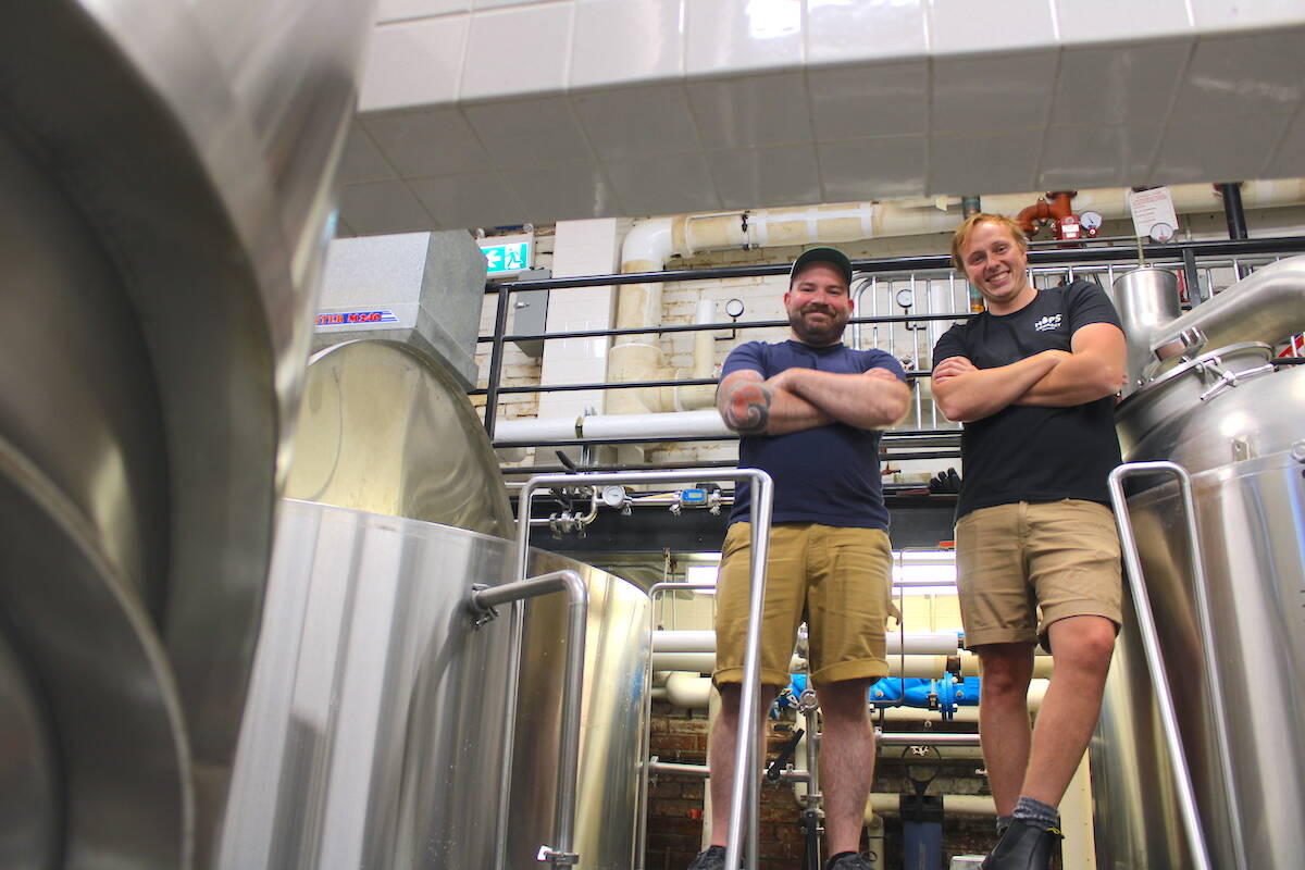 Head brewer Adam Morrow, left, and assistant brewer Patrick Sand at Swift Brewery. (Jake Romphf/News Staff)