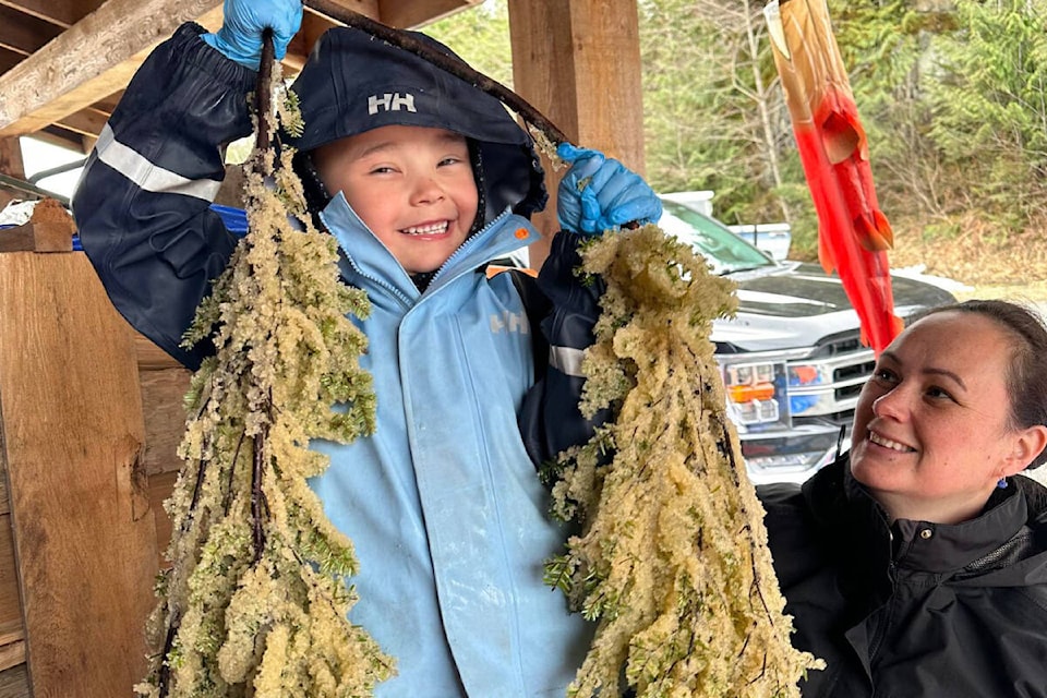 George Housty II (L), with his mother, Faye Housty, harvested kelp off the coast of Bella Bella, B.C. (Photo by William Housty)