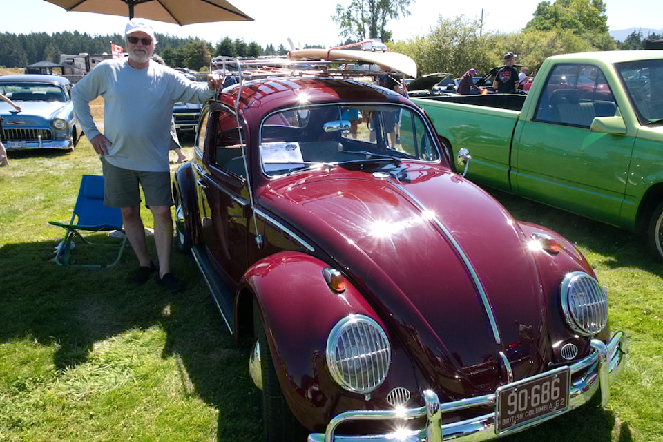 Steve Hawkins from Comox with his 1962 Volkswagen Beetle at the Parksville Car and Bike Show. Hawkins said his first car was a "Bug" 50 years ago and this one brought back a lot of memories.