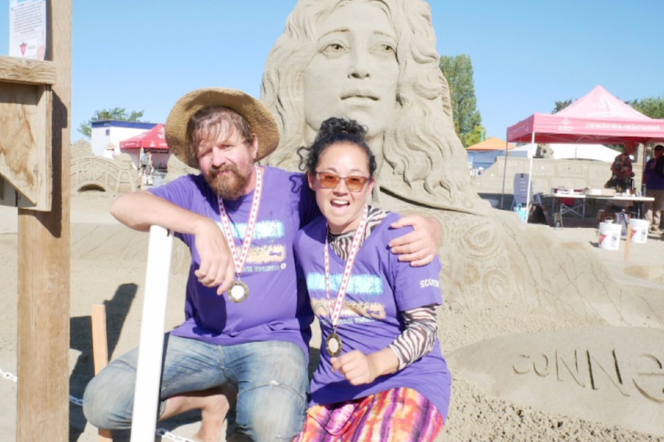 Dmitry Klimenko and Sue McGrew took first place in the doubles event at the Quality Foods Sand Sculpting Competition in Parksville on July 14.