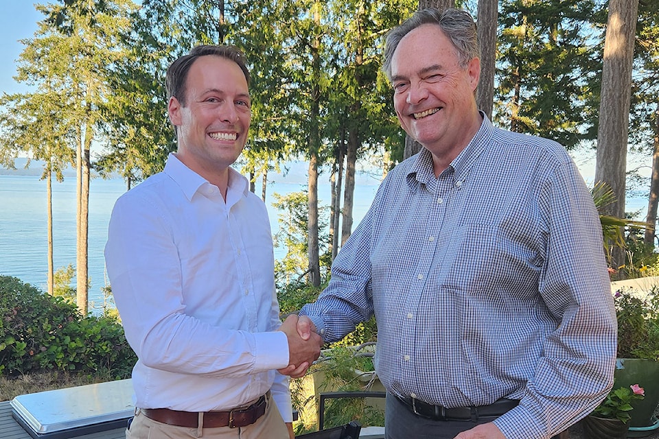 Parksville-Qualicum MLA Adam Walker, left, presented a King Charles III Coronation Medal to Ian Lindsay.