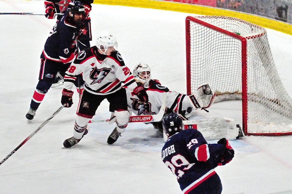 Oceanside Generals left winger Logan Lough fires a shot that was partly blocked by Campbell River Storm goalie Luc Gravel. 