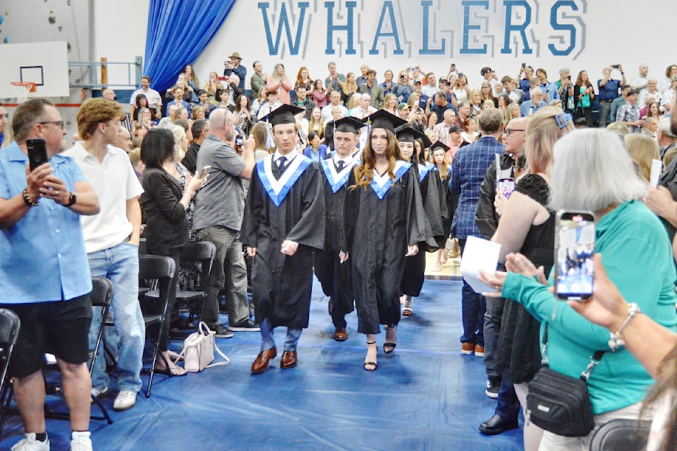The Ballenas Secondary Class of 2025 is applauded as they march to the stage for the commencement ceremonies on June 26.