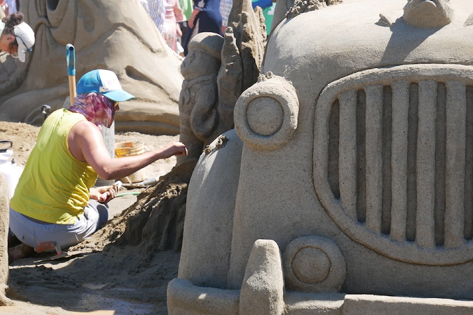 Morgan Rudluff works on her sculpture on the final day of the 2025 Quality Foods Sand Sculpting Competition in Parksville.