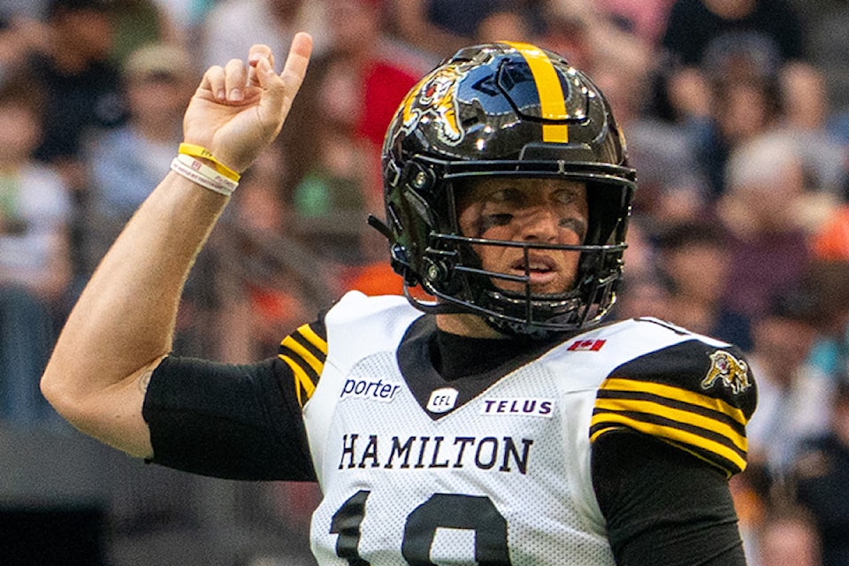 Hamilton Tiger Cats quarterback Bo Levi Mitchell celebrates a touchdown against the B.C. Lions during CFL action Sunday, July 27 at B.C. Place in Vancouver. 