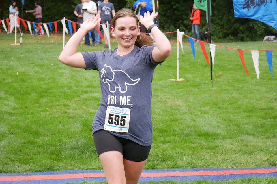 Laura Lucas from Nanaimo crosses the finish line of the Qualicum Beach Triathlon on June 22.