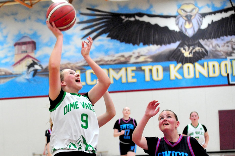 Dime Valley Oceanside U15 power forward Krista Grootendorst makes a hook shot against the Nanaimo Swish defence.