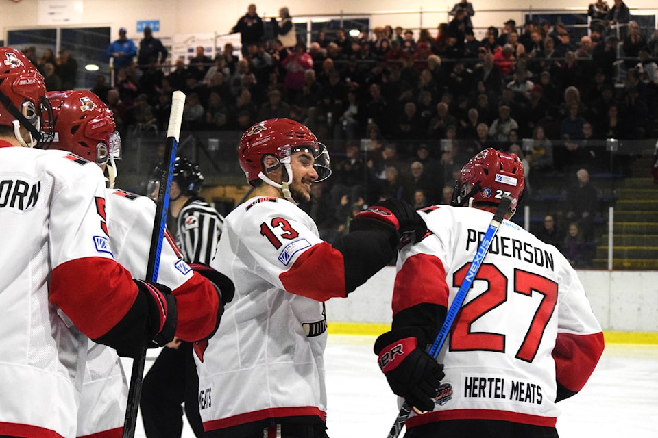 Bulldogs forward Jacob Bosse congratulations affiliate player Josh Pederson on his first BCHL goal in Parksville on Tuesday night. ELENA RARDON / ALBERNI VALLEY NEWS