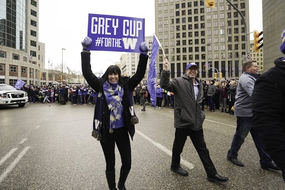 Chair of Winnipeg Blue Bombers board of directors Dayna Spiring joins Winnipeggers on downtown streets Tuesday, Nov. 26, 2019, to celebrate the end of a Grey Cup drought that lasted almost three decades. (THE CANADIAN PRESS/HO-Economic Development Winnipeg, Tyler Walsh)