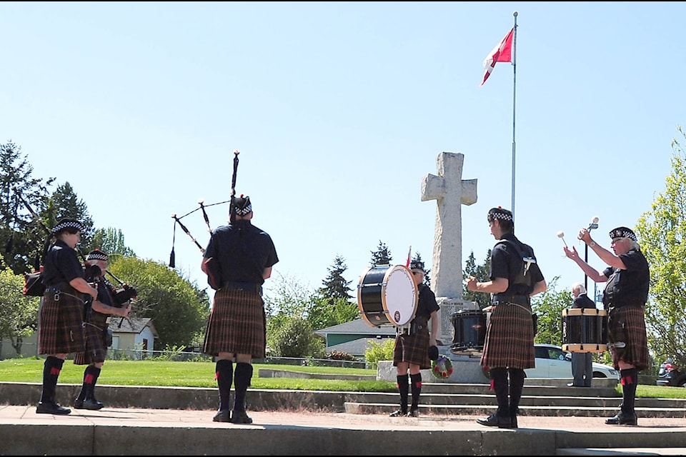 The Mount Arrowsmith Pipe Band plays at the small event to celebrate the 75th anniversary of the end of World War II at the Parksville Cenotaph on Friday afternoon. (Michael Briones photo)
