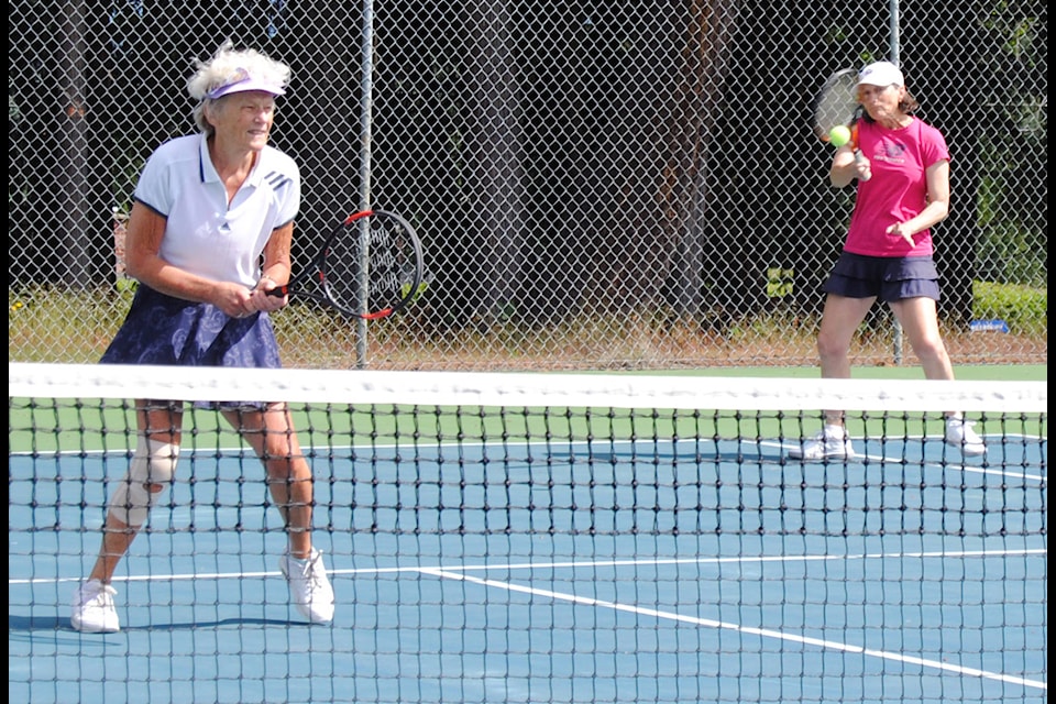 Lis Bangs, left, and Ada Sarsiat enjoys playing tennis again. Qualicum Beach tennis courts were re-opened on May 22. (Michael Briones photo)