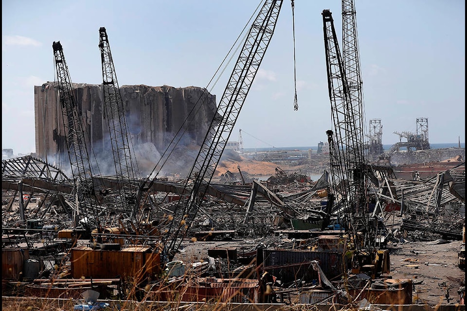 Extensive damage shows at the site of an explosion that hit the seaport of Beirut, Lebanon, Wednesday, Aug. 5, 2020. Residents of Beirut stunned, sleepless and stoic emerged Wednesday from the aftermath of a catastrophic explosion searching for missing relatives, bandaging their wounds and retrieving what’s left of their homes. (AP Photo/Hussein Malla)