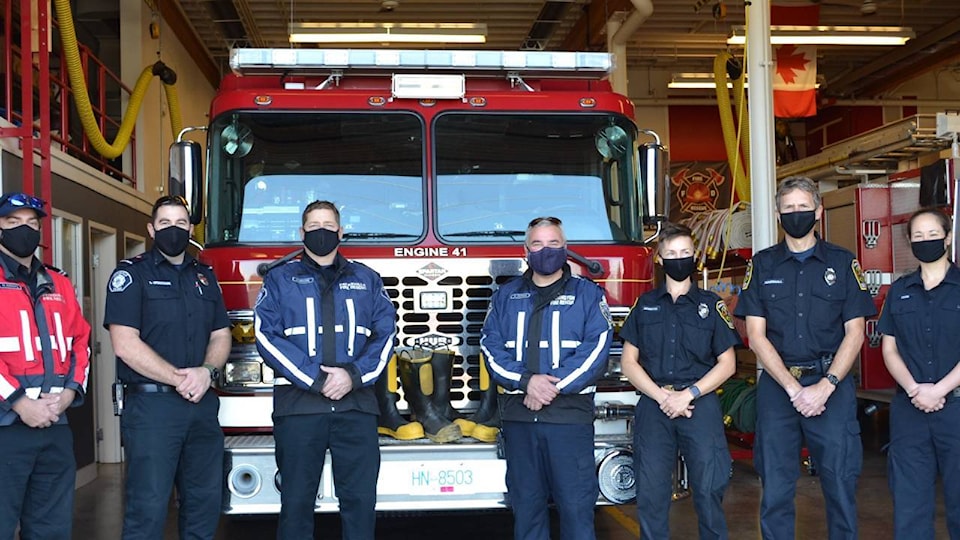 23169929_web1_201104-PQN-Boots-For-Food-Fire-Departments-groupshot_1