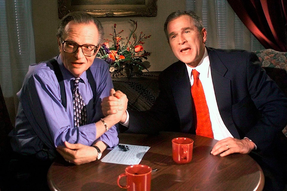 FILE - In this Dec. 16, 1999 file photo, Republican presidential candidate Texas Gov. George W. Bush jokes with CNN’s Larry King after finishing the “Larry King Live” show from the Wildhorse Saloon in Nashville, Tenn. King, who interviewed presidents, movie stars and ordinary Joes during a half-century in broadcasting, has died at age 87. Ora Media, the studio and network he co-founded, tweeted that King died Saturday, Jan. 23, 2021 morning at Cedars-Sinai Medical Center in Los Angeles. (AP Photo/John Russell, file)
