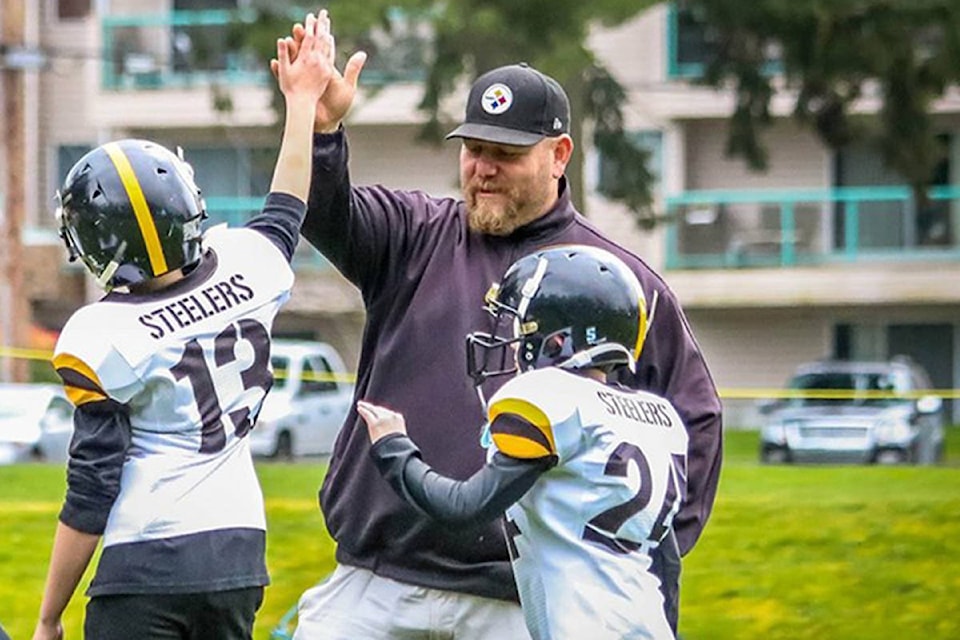 24062619_web1_210204-LCH-Steelers-Coach