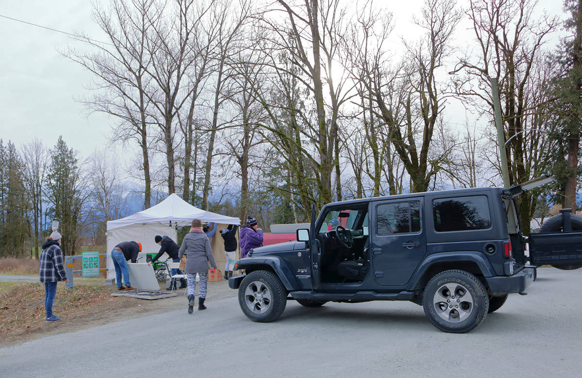 Organizers set up tables and a tent at the end of McSween Road in preparation for their search for Shaelene Keeler Bell on Sunday, Feb. 14, 2021. (Eric Buermeyer)