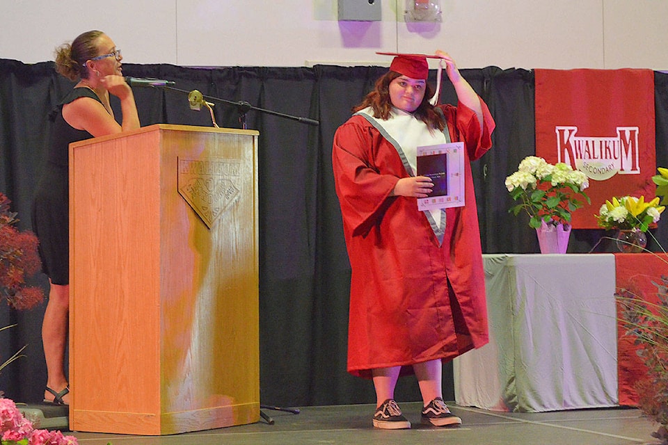 Graduate Chyse Smith as she accepts her diploma and flips the tassel. (Mandy Moraes)