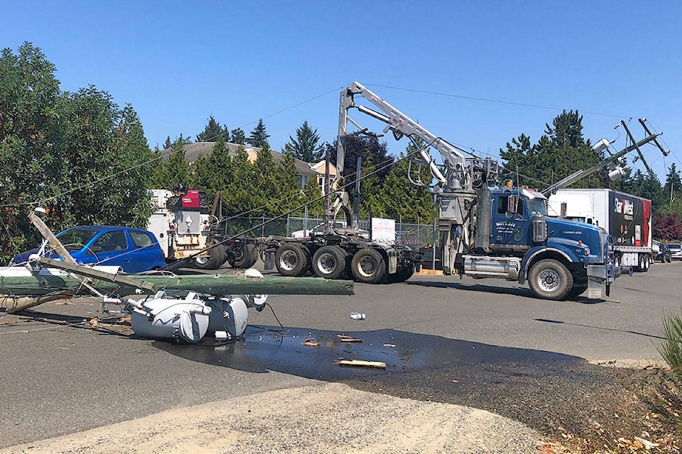 Three BC Hydro power lines were down near Herring Gull Way and Franklin’s Gull Road in Parksville on Wednesday, July 14. (Michael Briones photo).