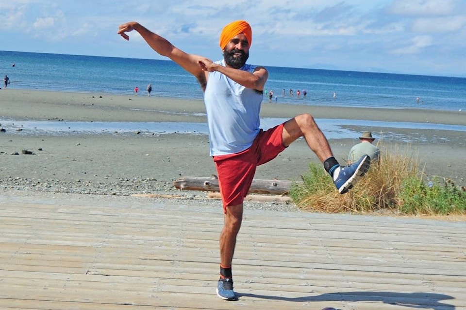 Bhangra dance instructor Gurdeep Pandher performs his ‘happy dance’ at the Parksville Community Park on Saturday, Aug. 7. (Michael Briones photo)