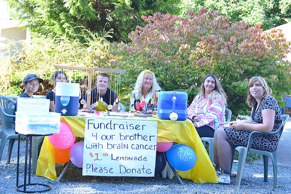 The Hohnstein family raising funds for their brother battling brain cancer at the Craft Fair on Clubhouse Drive in Qualicum Beach, Friday, Aug. 27, 2021. (Mandy Moraes photo)