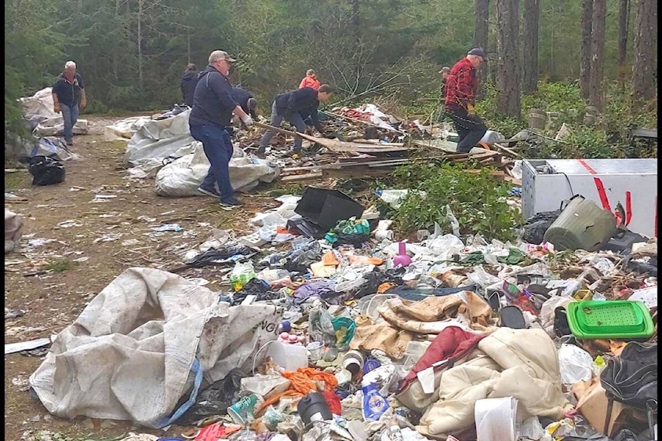 Volunteers deal with tons of trash on Claymore Road. (Submitted photo)