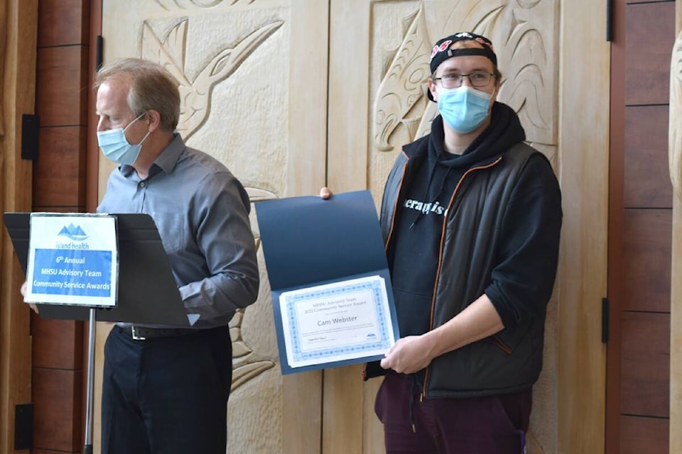 Cameron Webster, the subject of the Follow My Brain documentary, receives his Island Health Community Service Award on May 3. (Kiernan Green/News Staff)