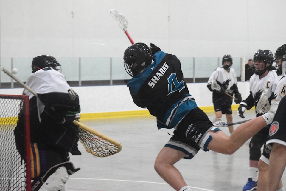 Diego Hopkins of the Oceanside Sharks makes a diving shot on the Saanich Express goal during a game at the Alberni Valley Multiplex on May 7, 2022. (ELENA RARDON / ALBERNI VALLEY NEWS)