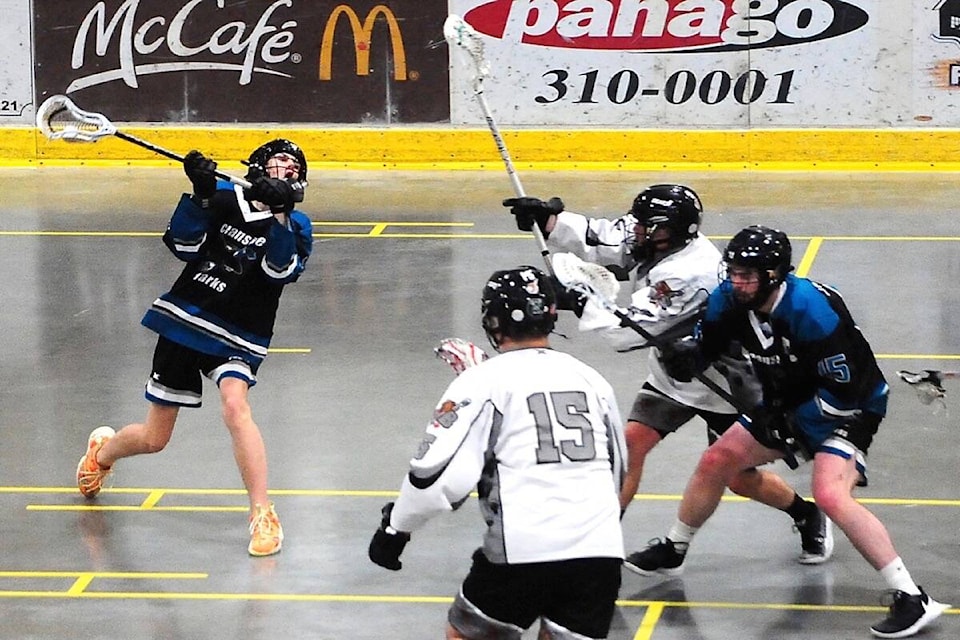 Oceanside Sharks player Blake Knoll launches a shot against the Westshore Bears that ended up in the back of the net during their Pacific Northwest Junior Lacrosse League game on Sunday, May 29 at Oceanside Place. (Michael Briones photo)