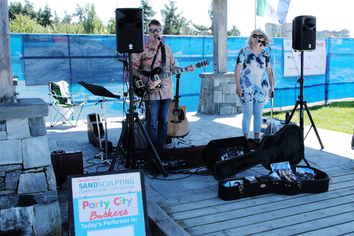 Buskers entertain visitors daily through Aug. 21 at the Boardwalk Gazebo, near the sand sculptures. Photo courtesy Parksville Beach Festival