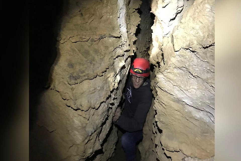 It’s a tight squeeze (roughly a foot) for PQB News reporter Kevin Forsyth as he exits Main Cave at Horne Lake Caves, west of Qualicum Beach. (Chloe White photo)