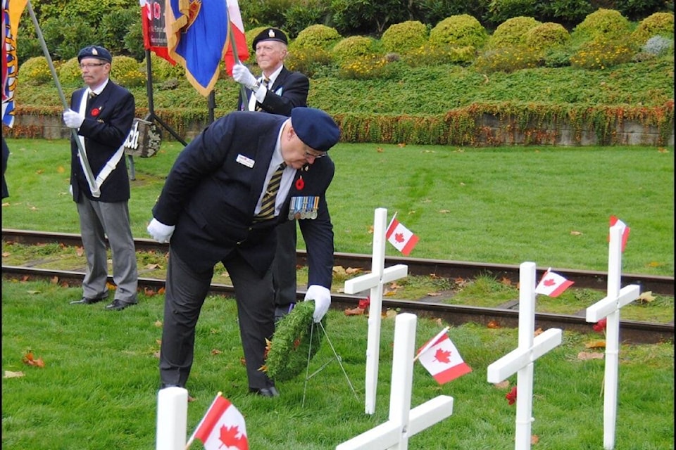 30680163_web1_211103-PQN-Field-Of-Crosses-laying-of-wreath_1