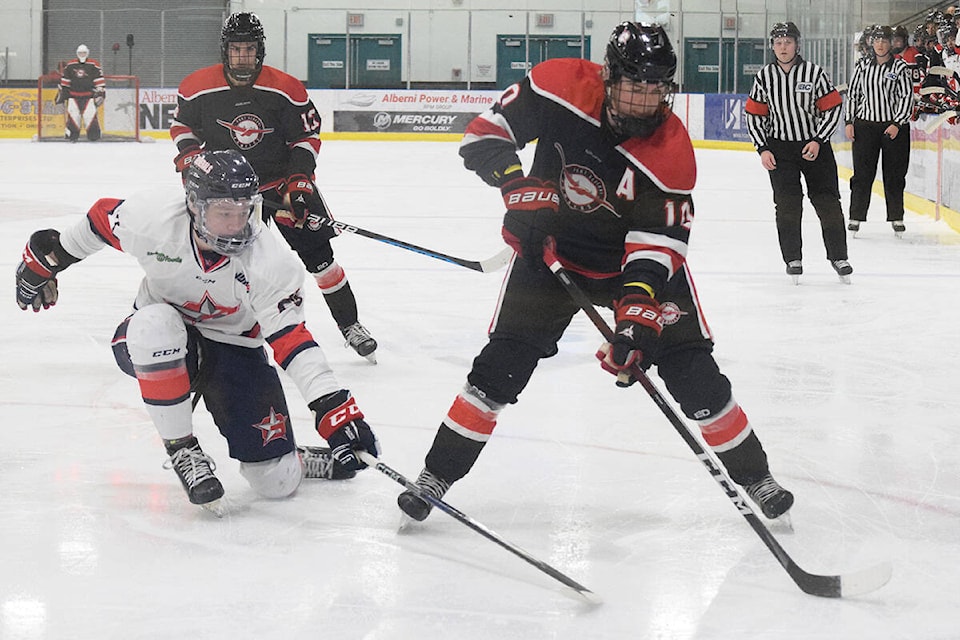 Tyson Pauze of the Oceanside Generals attempts to block a shot from Carson Steel of the Port Alberni Bombers during a game at the Alberni Valley Multiplex on Jan. 18. (ELENA RARDON / Alberni Valley News)