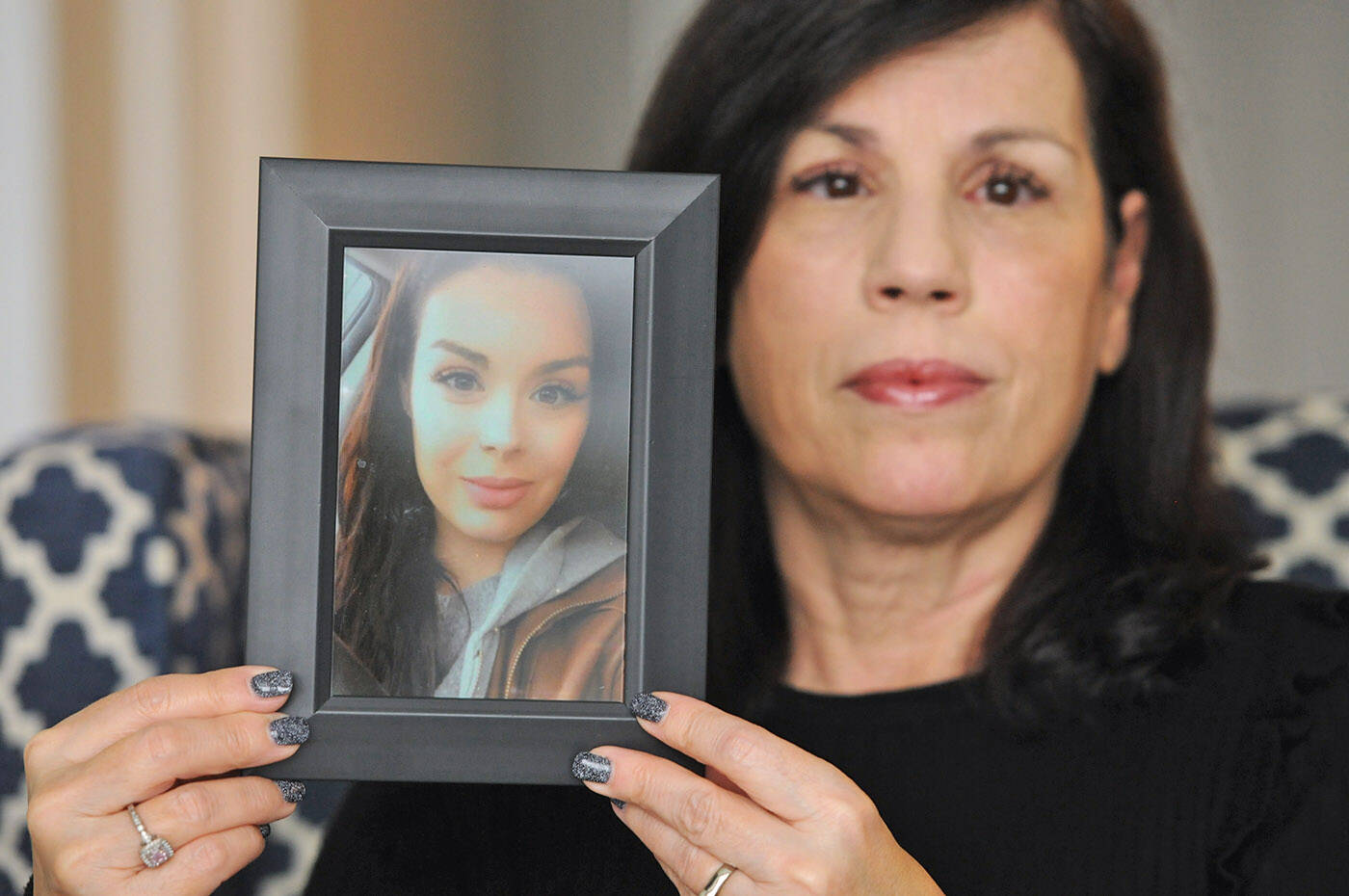 Alina Durham holds a photo of her daughter Shaelene Bell in her home on Jan. 12, 2023. Bell went missing on Jan. 30, 2021 and her body was found on June 2, 2021 in the Fraser River near Coquitlam. Durham has been trying for 18 months to get Shaelenes Missing Adult Alert in place, but nothing has happened. (Jenna Hauck/ Chilliwack Progress)