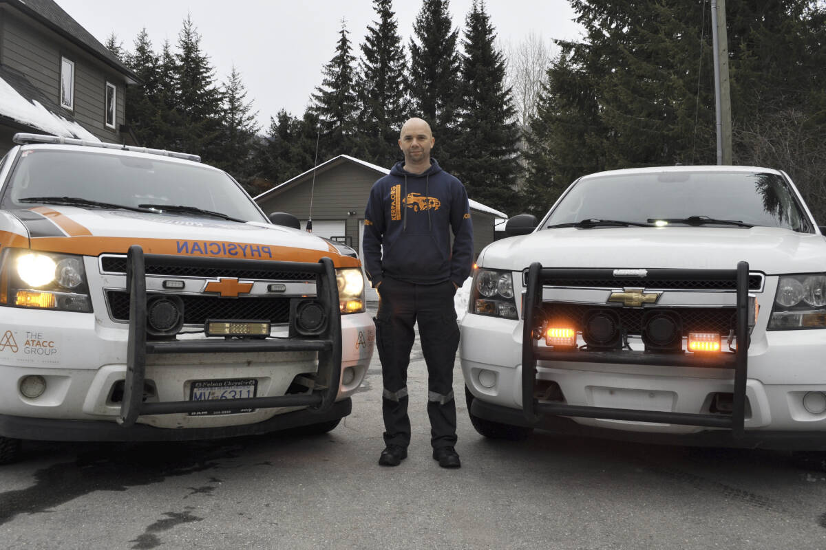 Dr. Nicholas Sparrow stands with two KERPA vehicles. The one on the right is brand new and will be used by a new doctor so the charity can expand its service. Photo: Tyler Harper