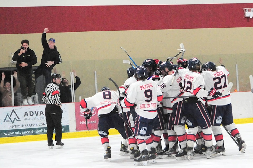The Oceanside Generals celebrate after winning the VIJHL North Island title, beating the Campbell River Storm 5-4 in double overtime in Game 5. (Michael Briones photo)