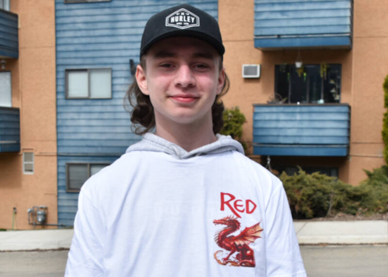 Seth Cowan, a good friend of Rob Konkle, wears one of the T-shirts made for the memorial on April 1 that recognizes Konkle, whose nickname was Red, as well as his love for dragons. (Martha Wickett-Salmon Arm Observer)