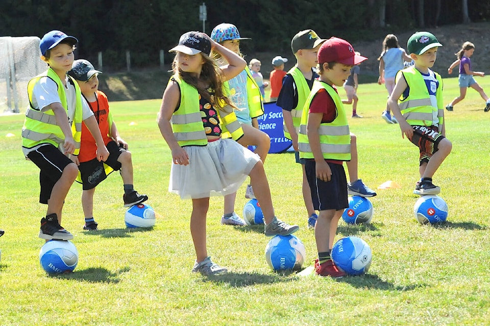 Children from BGCCVI go through some drills during the soccer camp hosted by the Vancouver Whitecaps FC at Qualicum Beach Community Park on July 27. (Michael Briones photo)